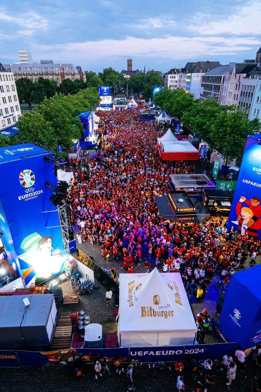 The Cologne Old Town with a large stage and festival setup from a bird's eye view.