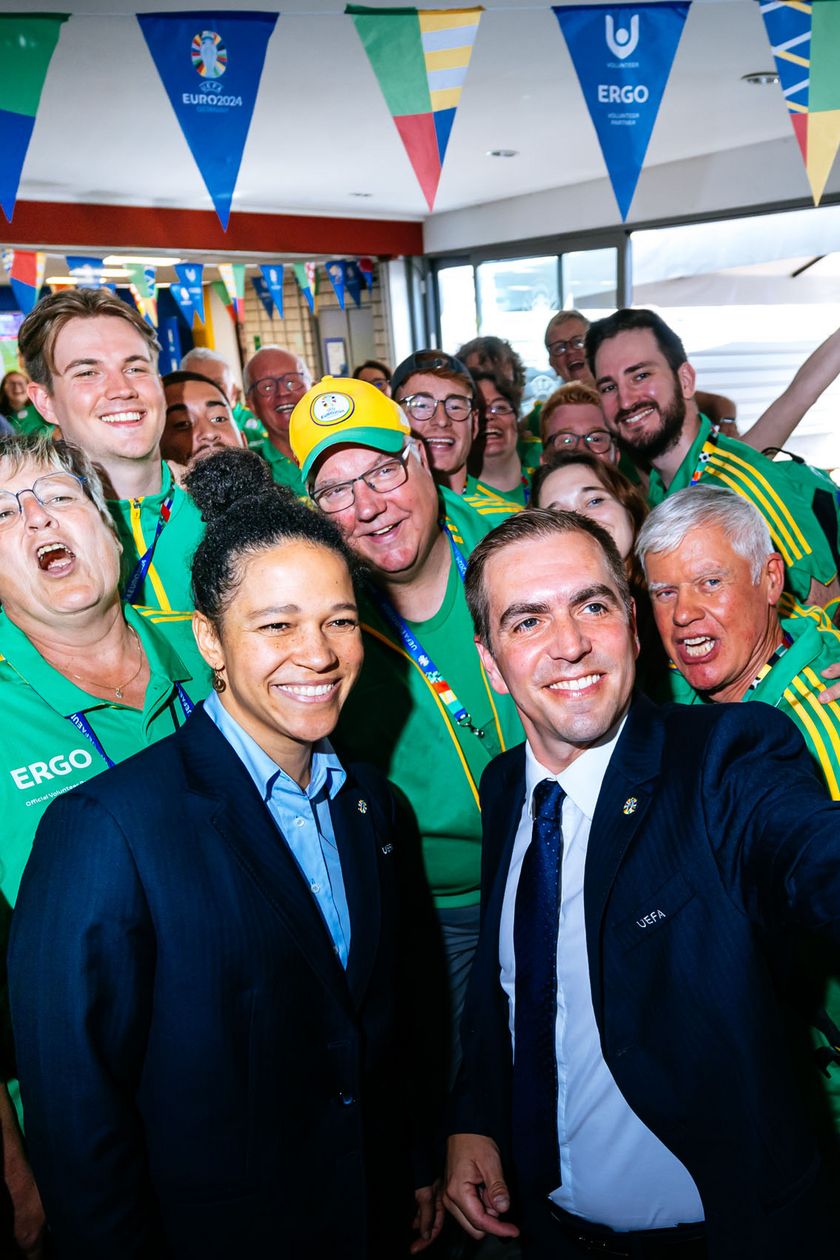 A group of people is taking a selfie.