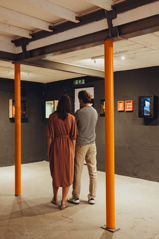 Two people are viewing abstract art.